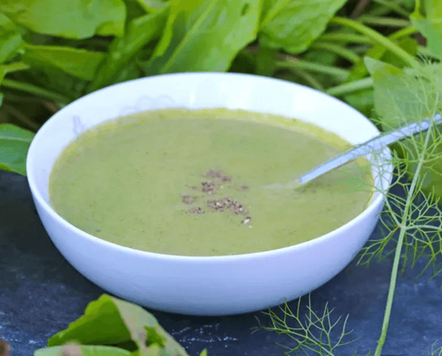 Winter, green soup with some greeny leaves around